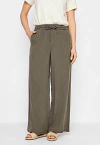 Olijfgroene wijde broek met een elastische tailleband en een trekkoord. Lichte stof, met zijzakken en een losse pasvorm.