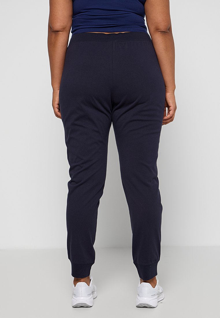 Marineblaue Sweatpants mit elastischem Bund und Bündchen, aus weichem Stoff gefertigt, mit glatter Textur und entspannter Passform.