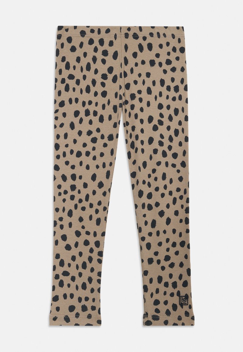 Tan leggingi z razpršenim črnimi pikami, narejeni iz mehkega materiala s prilagojeno zasnovo in elastičnim pasom.