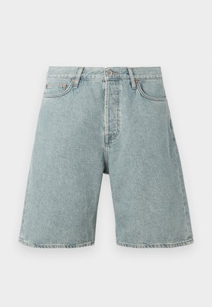 Šviesiai mėlyni džinsiniai šortai su laisvu siluetu, penkiomis kišenėmis ir užsegimu kniedėmis. Dėvėta tekstūra su matomais siuvimo detalėmis.