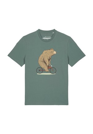 T-shirt vert à manches courtes avec un graphique représentant un ours brun montant un petit vélo rouge en vue latérale.