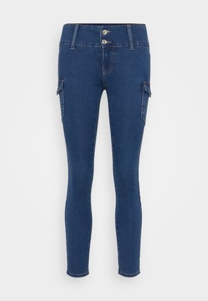 Dark blue denim skinny jeans with a high waist, two front pockets, and cargo-style side pockets. Features double-button closure.