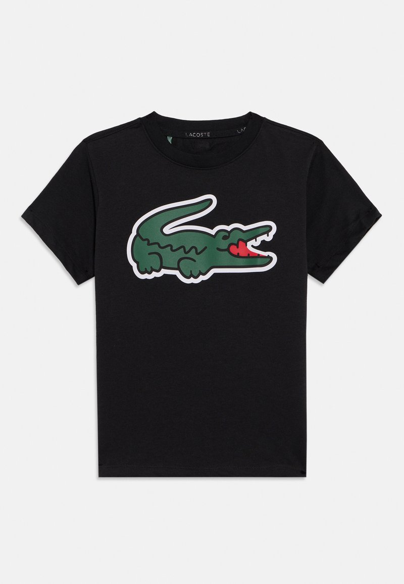 Μαύρο βαμβακερό μπλουζάκι με μεγάλο πράσινο κροκόδειλο και κόκκινη γλώσσα. Κλασικός σχεδιασμός με στρογγυλή λαιμόκοψη και κοντά μανίκια.