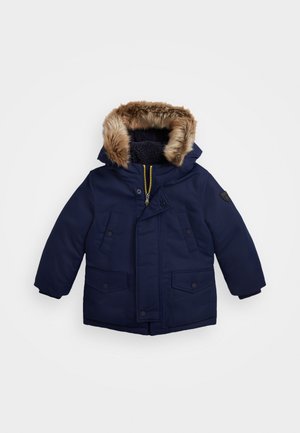 Navy blue parka with faux fur-lined hood, zip closure, two front pockets, and ribbed cuffs, designed for warmth and comfort.