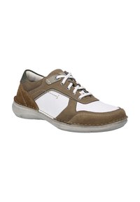 Brown and white sneaker featuring a mix of leather and suede, rounded toe, lace closure, and a textured rubber sole.