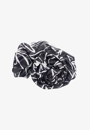 Écharpe noire et blanche avec des lignes blanches abstraites, enroulée de manière lâche sur un fond blanc.