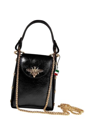 Black leather handbag with top handle, gold chain strap, and gold bee embellishment on front flap, featuring a small Italian flag charm.