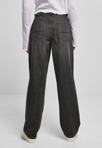 Urban Classics Flared-farkut - black washed