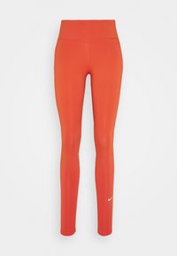 Leggings sportivi rossi realizzati in tessuto elasticizzato, con vita alta e un piccolo logo Nike bianco sulla parte inferiore della gamba sinistra. Texture liscia.