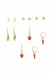 Gold-tone earring set featuring fruit and vegetable designs: banana studs, mushroom studs, strawberry and chili charms on hoop earrings.