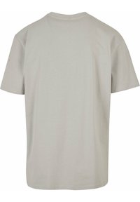 Lys grå, kortærmet T-shirt lavet af blød stof. Rund halsudskæring med et enkelt, udekoreret design. Ingen synlige mønstre eller hardware.