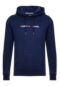 Sudadera azul marino hecha de una mezcla de algodón. Presenta un bolsillo canguro, puños acanalados y un logo bordado de "TOMMY JEANS" en blanco y rojo.