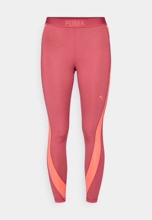 PUMA leggings in deep pink with horizontal orange accents and a logo at the waistband. Smooth, stretchy fabric with a fitted design.