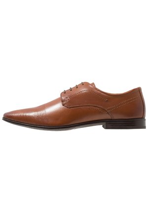 Brown leather men's oxford shoe with pointed toe, side stitching details, and black sole viewed from the outer side.