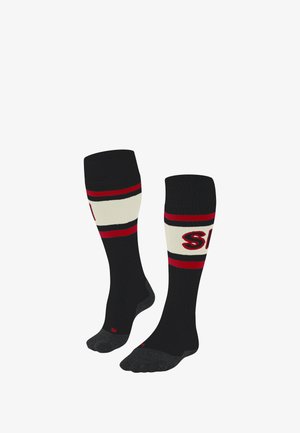Black knee-high socks with red and cream stripes, featuring ribbed texture and logo detail. Reinforced heel and toe sections.