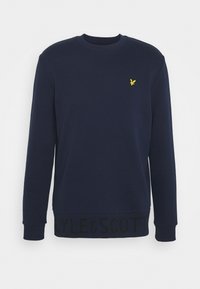 Sudadera navy de manga larga, con cuello redondo acanalado y dobladillo texturizado que presenta un nombre de marca en negro. Logotipo bordado amarillo en el pecho.