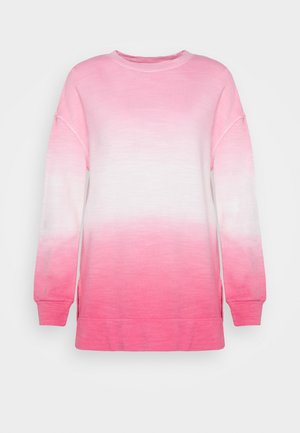 Bluza z długim rękawem i okrągłym dekoltem z gradientem od różowego do białego, z prążkowanymi mankietami i bocznymi rozcięciami na dole, prezentowana na jednolitym tle.