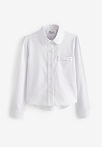 Camicia bianca a maniche lunghe con colletto arrotondato, bottoni frontali e taschino sul petto decorato con un piccolo fiocco di stoffa.