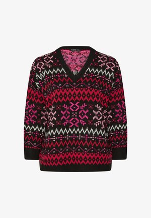 Mehrfarbiger gestrickter Pullover mit schwarzem Grund und auffälligen geometrischen Mustern in Pink, Weiß und Lila. V-Ausschnitt und lange Ärmel.