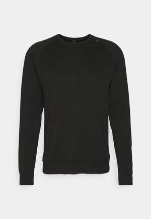 Svart sweatshirt med strukturerad övre panel, långa ärmar och ribbat manschetter. Har en enkel rund hals och subtila stickningsdetaljer.
