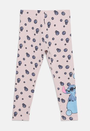 Pink leggings with scattered blue bubble patterns and a small blue cartoon character sitting on a large bubble near the ankle.