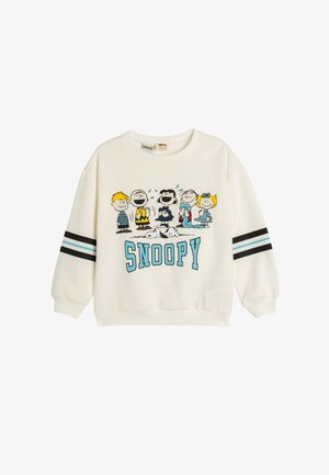 Crème-kleurige sweatshirt met een cartoonafbeelding van "Peanuts"-figuren, met blauwe en zwarte gestreepte accenten op de mouwen.