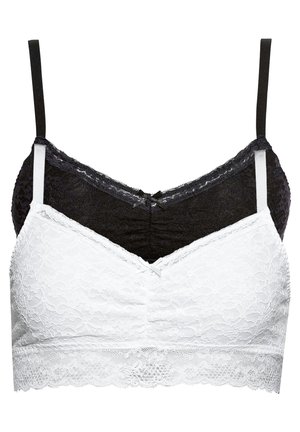 Set di bralette in pizzo bianco e nero con spalline regolabili, caratterizzato da motivi floreali, tessuto testurizzato e design a V.