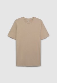 T-shirt di cotone beige con scollo rotondo, maniche corte e vestibilità comoda. Nessun motivo o dettaglio visibile. Taglia indicata come XL.