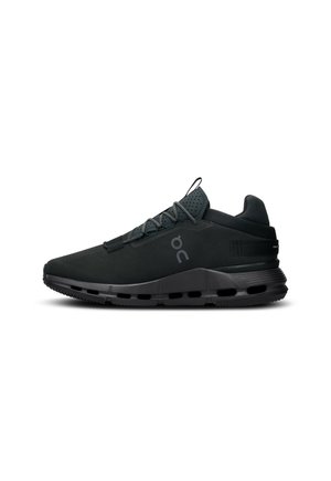 Black athletic shoes with a sleek design, featuring a mesh upper, textured heel, cushioned sole, and distinctive logo on the side.