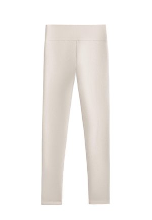 Leggings di un leggero beige realizzati in un materiale liscio e elasticizzato. Presentano una vita alta e larga e una forma aderente, senza cuciture o motivi visibili.