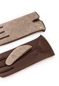 Brown leather gloves featuring a light brown felt cuff, with a brass logo accent. The design includes five fingers and a decorative seam detail.