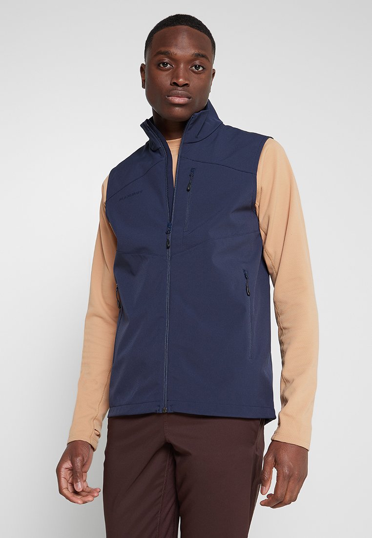 Granatowa, bezrękawnikowa kamizelka z zamkiem z przodu, dwiema bocznymi kieszeniami i kieszenią na piersi, wykonana z gładkiego, lekkiego materiału.