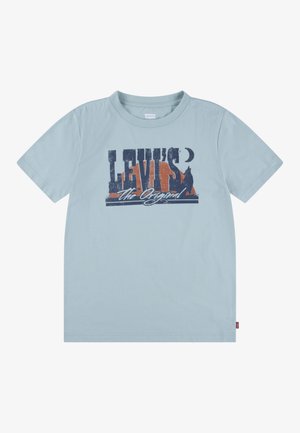 Light blue cotton T-shirt featuring a graphic print with "LEVI'S" and "The Original" in dark blue and orange hues. Round neckline and short sleeves.