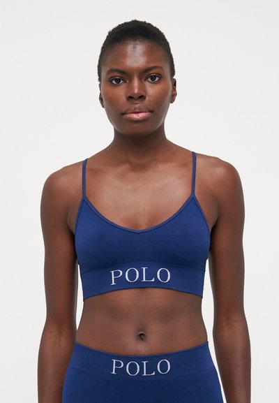 Tengerész kék bralette vékony állítható pántokkal és a POL logóval a pánton; bordás textúrájú anyagból készült a kényelmes illeszkedés érdekében.