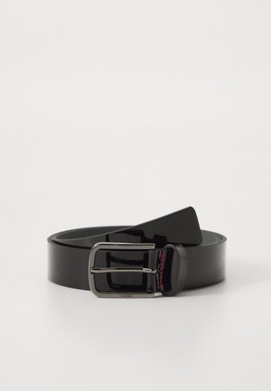 Black glossy leather belt with a rectangular silver buckle, featuring red stitching accents. Smooth texture and slim design.