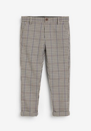 Pantalon pour homme beige et noir à carreaux, avec fermeture à boutons, poches latérales, passants pour ceinture et revers retroussés.