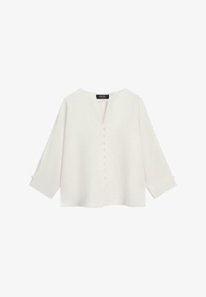 Hvid bluse med lange ærmer, V-formet slids og en række dækkede knapper på midten, med løs pasform og minimalistisk design.
