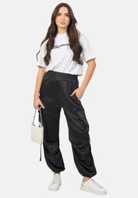 Disclaimer Pantaloni cargo - nero
