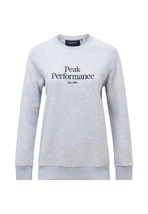 Felpa grigia chiara con maniche lunghe a raglan. Presenta la scritta nera "Peak Performance Est.1986" sul davanti. Tessuto morbido, polsini a costine.