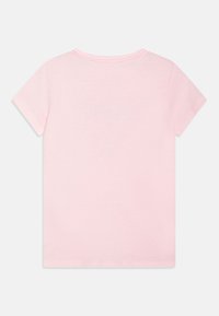 Pink short-sleeve t-shirt. Smooth texture, rounded neckline, and a simple, solid design. No patterns or additional details visible.