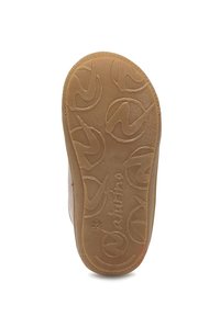 Suola di scarpa in gomma marrone chiaro con motivi circolari testurizzati e marchio, che mostra una superficie antiscivolo e un tacco arrotondato.
