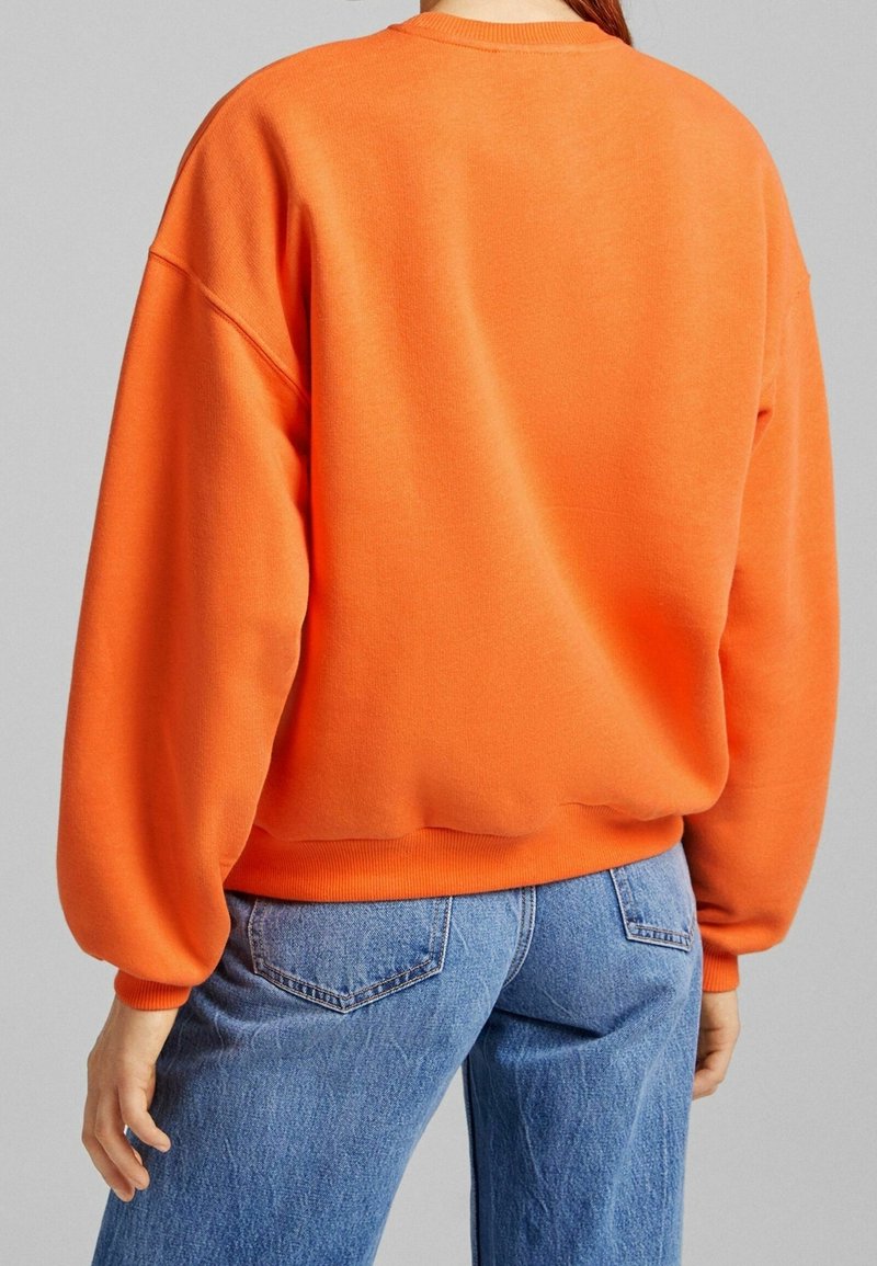 Sweat Bershka Femme Orange Taille M - Graphique Michigan, Col Rond, Manches Longues, Coton