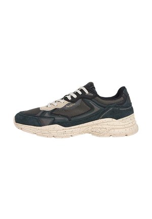Sneakers with a black mesh and suede upper, cream speckled sole, and white laces, featuring a chunky design and contrasting textures.
