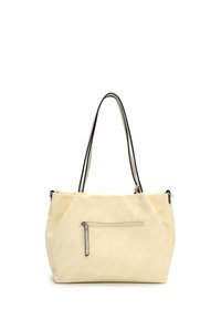 Beige canvas draagtas met twee zwarte handvatten, voorzien van een voorvakken met ritssluiting en unieke hoekige naden voor extra textuur en design.