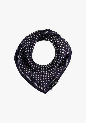 Écharpe en soie bleu marine à pois blancs avec un motif de bordure cousue, pliée en forme de triangle avec une étiquette de tissu visible.