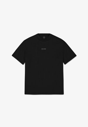 Mustapaita, jossa on lyhyet hihat, pyöreä pääntie ja pieni valkoinen "JOHNNY URBAN" -tulostus edessä. Sujuva pinta.