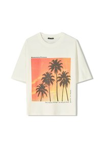 White short-sleeve T-shirt featuring a graphic print of black palm trees against a gradient orange and pink background, with text.