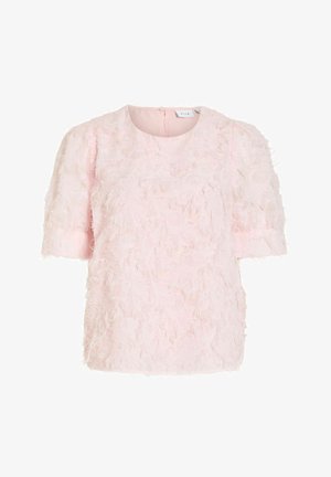 Blouse rose clair à manches courtes avec tissu texturé plumeux et col rond, dotée d'une fermeture éclair au dos.