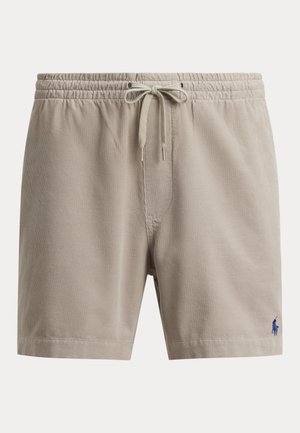 Short en velours côtelé beige avec taille élastique et cordon, avec un petit logo brodé bleu marine sur la partie inférieure de la jambe droite.