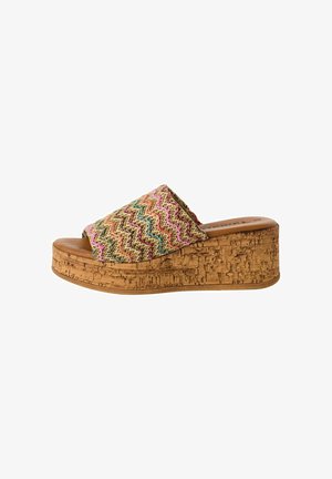 Sandale à enfiler tissée avec un motif zigzag multicolore sur le dessus, semelle en liege et semelle intérieure beige.